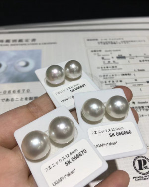 Pair of white South Sea pearls: 12-13mm, AAAA+, very strong luster